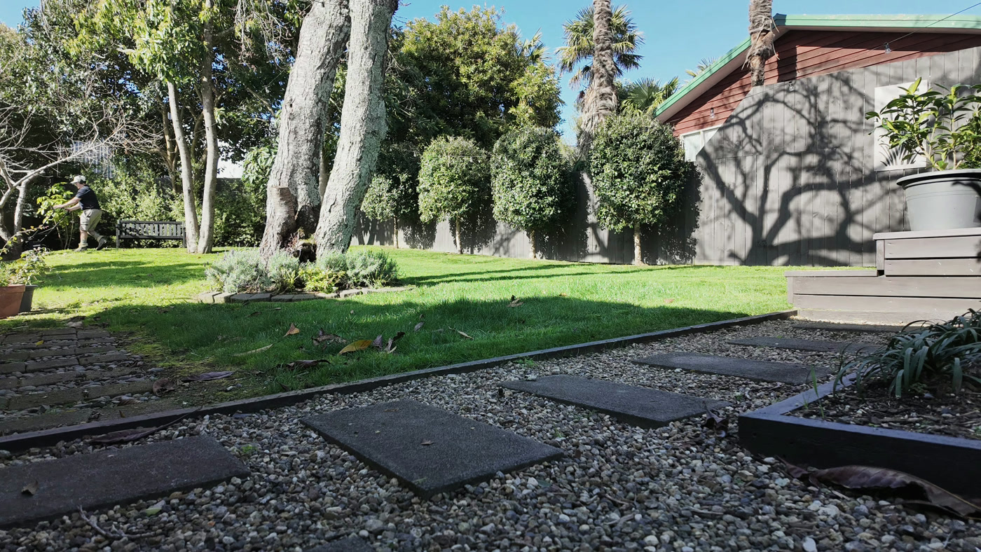 A Territory operator mowing a residential lawn